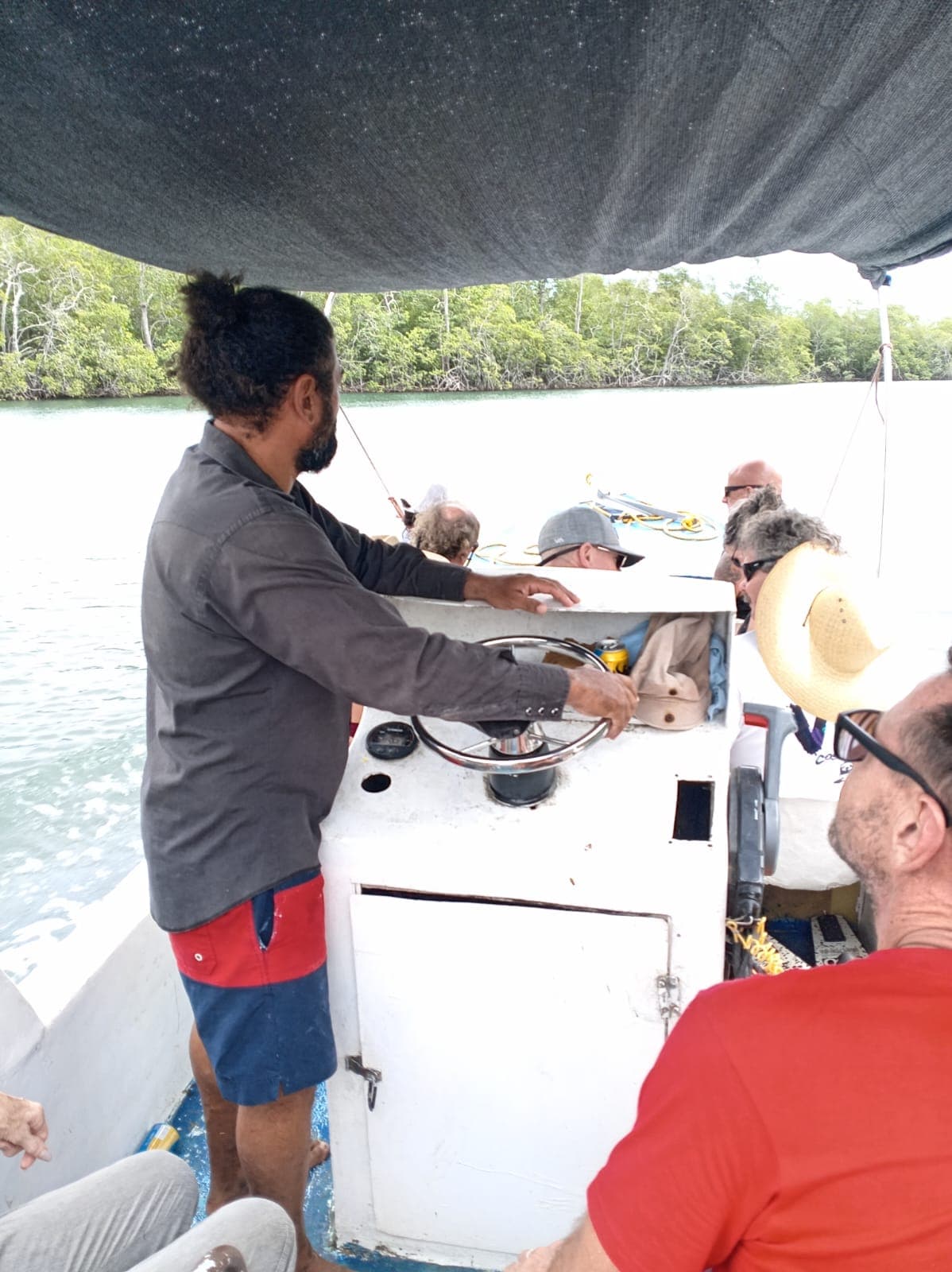 Captain Edgar at the helm of Punta Aguja in the Tamarindo estuary